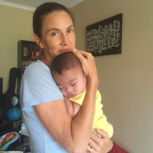 Jenn with Jasel's infant son