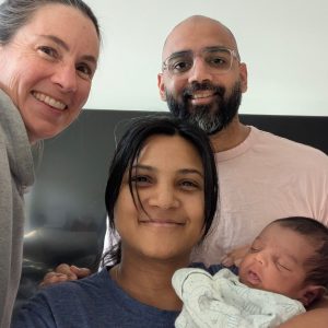 Jenn with Nidhi, Jay & their infant son [Jan 2026]