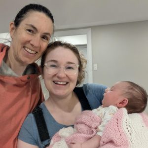 Jenn with Emily and infant daughter