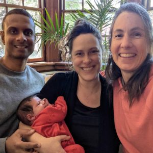Jenn with Harish, Miranda & their infant daughter [May 2026]